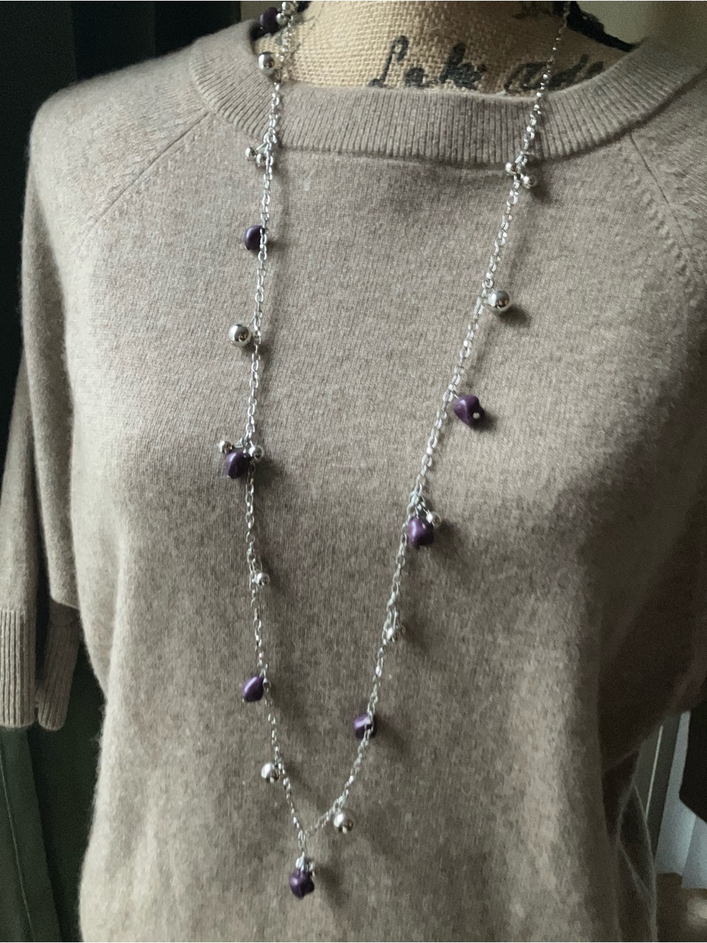 Silver necklace with purple stone accents